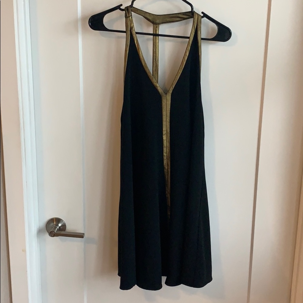 Flowy, black and gold mini dress.